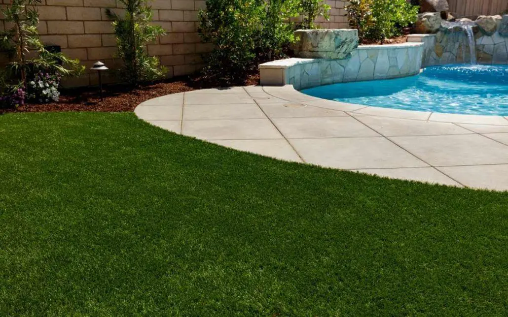 artificial grass around pool - provides a safe ground cover because it's non-slip