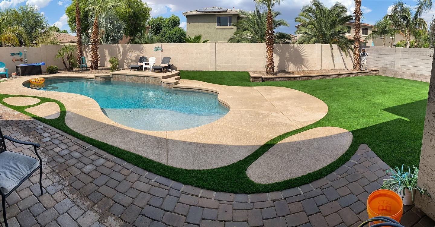 the turf around this pool in Palm Desert CA provides its owners and their kids a slip-free surface entering the water